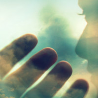 Image of a face and hand